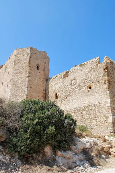 Close-up of stone ruins of walls and tower of Kritinia Castle, Kritinia Village, Rhodes Island, Greece