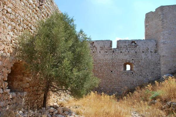 View of the stone walls with loopholes from inside the ruins of Kritinia Castle, Kritinia Village, Rhodes Island, Greece