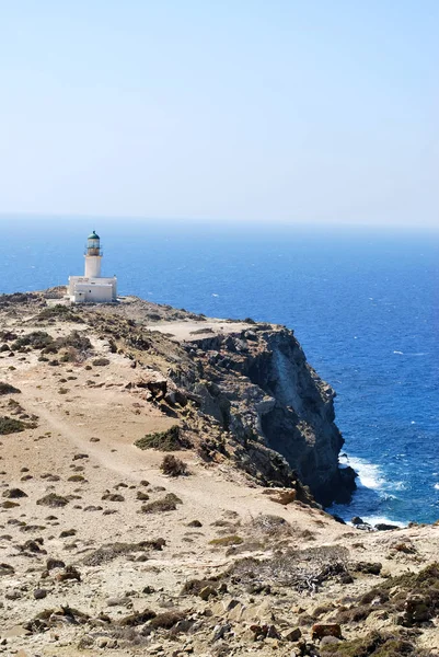 View of the lighthouse on a stone cliff above the sea against the sky, Prasonisi, Rhodes island, Greece
