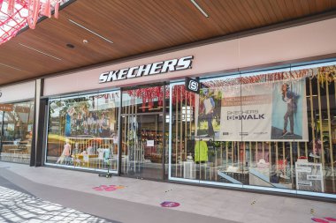 Samut Prakan, Thailand - July 28, 2020: Skechers shop in Siam Premium Outlets Bangkok. Skechers is an American lifestyle and performance footwear company founded in 1992 by Robert Greenberg. clipart