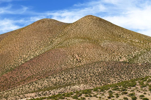 View of desert mountains along the road to the El Tatio geysers near the Termas de Puritama, Atacama Desert, Chile