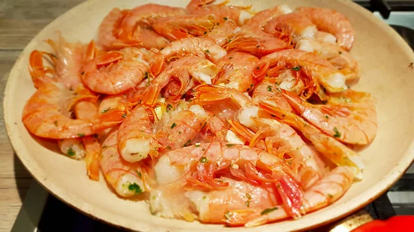 Grilled prawns marinated in garlic and parsley. Italian cuisine and food