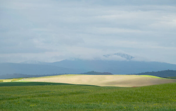 Val d'Orcia landscape in spring. Hills of Tuscany. 