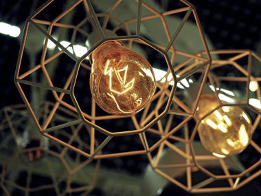 Lüks ve kentsel tasarım parlayan ışık Ampüller lamba bulanık arka plan ile yuvarlak.