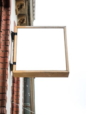 Eski Şehir tuğla duvar arka plan dış ekran ile ahşap çerçeve boş beyaz mock-up tabela tabela yan görünümü.