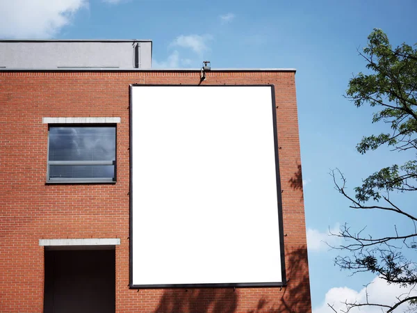 University building facade, Blank white paper board at grunge brick red wall texture background, Mock up ads template, Business presentation content concept.