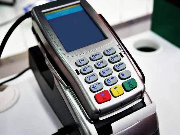Close up of machine to pay with credit card swipe through terminal for payment in a shopping store, Isometric POS terminal confirms the payment by debit credit card.