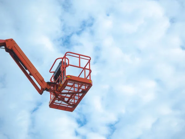 Telescopic Boom Lifts in storage area, Electrical technician repairing street light by boom lift, Lift platform and basket to work in high places with security.