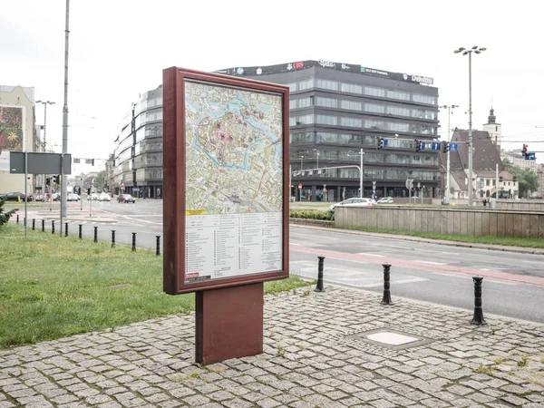 A Wroclaw city town guide map and transportation on billboard for advertisement in a city, with building view on background, Wroclaw, Poland, 17 August 2017. — Stock Photo, Image