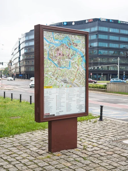 A Wroclaw city town guide map and transportation on billboard for advertisement in a city, with building view on background, Wroclaw, Poland, 17 August 2017. — Stock Photo, Image