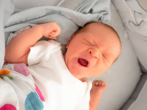 Cute new born mixed race baby yawning before sleep, Sleeping beautiful, mixed race Asian Caucasian boy