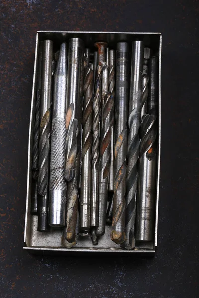 set of drill bits for drills on a vintage background