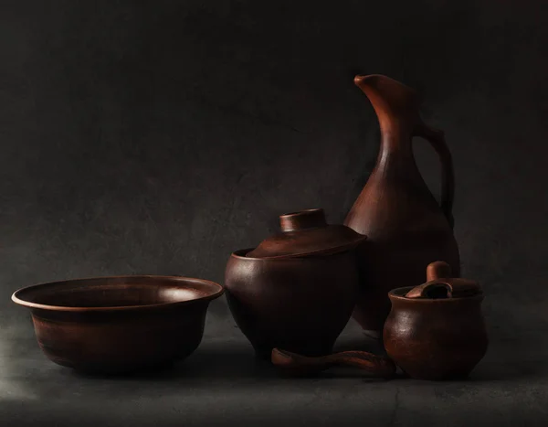 still life with pottery in low key style