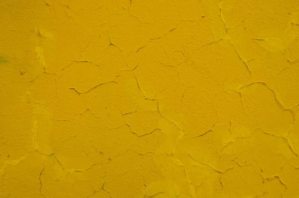 texture of cracked yellow wall