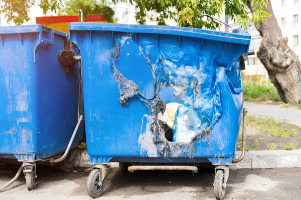 Blue plastic molten trash can