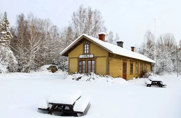 Old train station covered by snow in Sweden