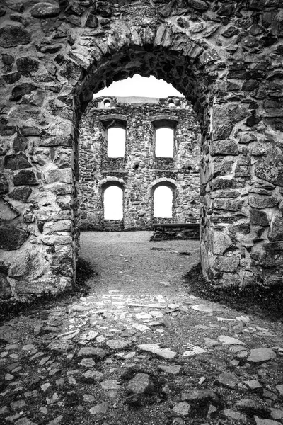 Black and white picture of stone Brahehus castle in Sweden