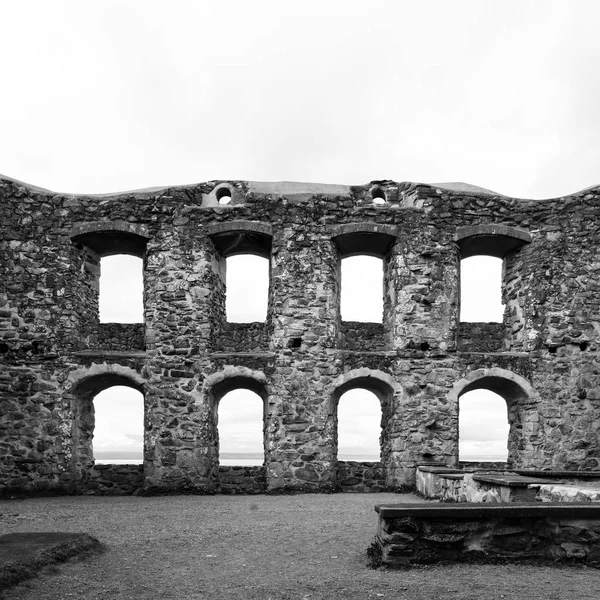 Black and white picture of stone Brahehus castle in Sweden