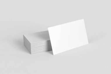 Kadar yumuşak gri arka plan üzerinde boş adının kartvizit yığını alay et. 3D render