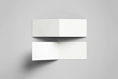 İki kanatlı yumuşak gri arka plan üzerinde izole boş tebrik kartları. Katlanmış iş kartı 3d render.