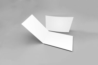 İki kanatlı yumuşak gri arka plan üzerinde izole boş tebrik kartları. Katlanmış iş kartı 3d render.