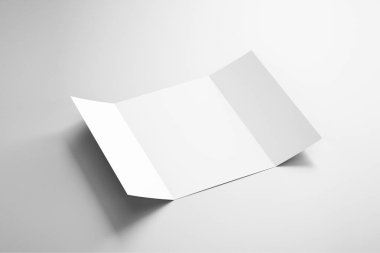Boş Kağıt Broşür Yumuşak gölgeler ve vurgular ile yumuşak gri arka plan üzerinde mock. Z-fold broşür veya el ilanı.3d render.