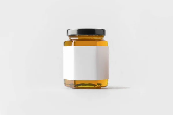 Glass jar of Honey with blank label on white background. Mock up. 3D rendering.