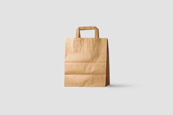 棕色纸袋模拟在浅灰色背景上隔离 逼真的照片 购物袋 — 图库照片