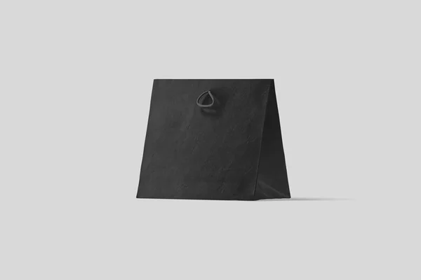 黑色纸袋模拟在浅灰色背景上隔离 逼真的照片 — 图库照片