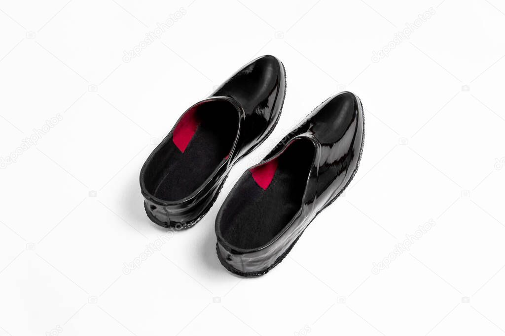 Pair of black rubber overshoe waterproof galoshes isolated on white background.High-resolution photo.