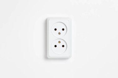 A white double socket on white background.Electric plug. European high voltage 220W sockets.High-resolution photo. clipart