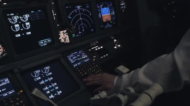 Pilot sets the course inside the airplane cockpit — Stock Video