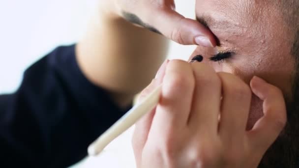 Bearded Man Getting Eyelashes Painting — Stock Video