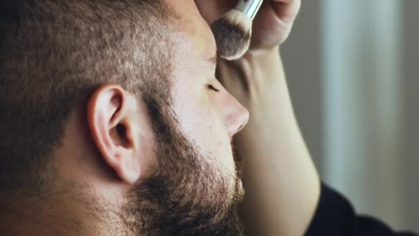 Makeup Artist Applying Makeup On Actor — Stock Video