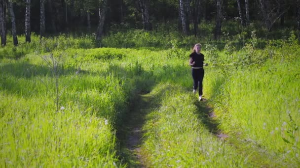 Female running in the forest — Stock Video