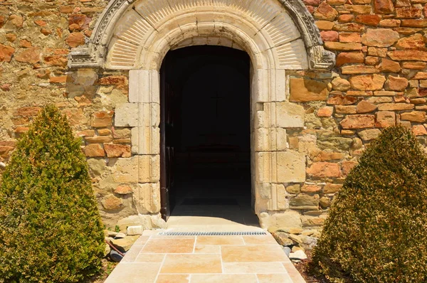 A open door from a small church