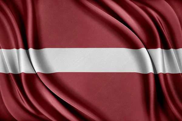 Příznak, Lotyšsko. Vlajka s lesklé hedvábné textury. — Stock fotografie