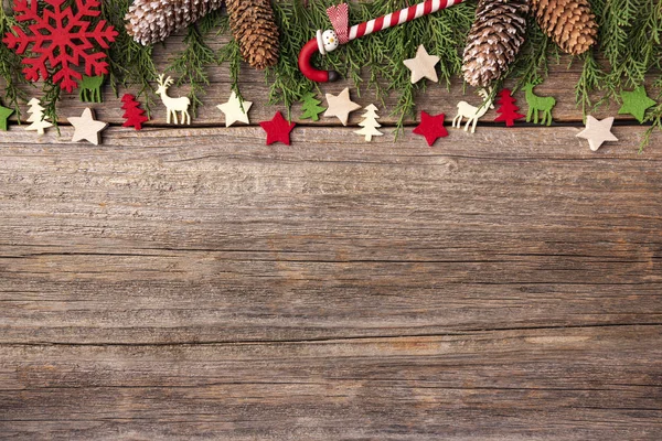 Composition from festive objects of New Year and Christmas on a wooden background. — Stock Photo, Image
