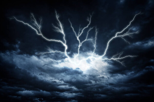 Lightning strike on the dark cloudy sky.