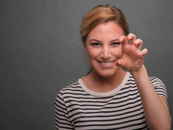 Beautiful young woman showing claws.