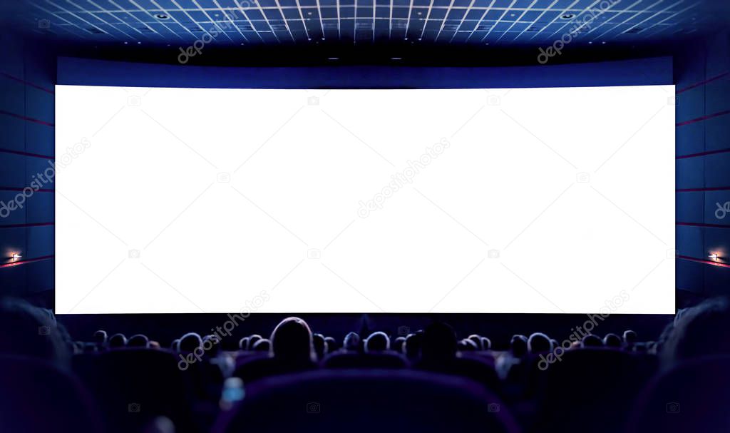 White screen in the cinema and the audience watching the movie. Cinema.