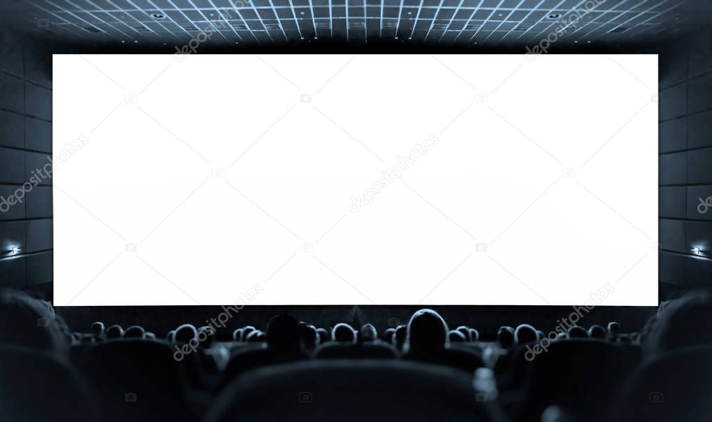 White screen in the cinema and the audience watching the movie. Cinema.