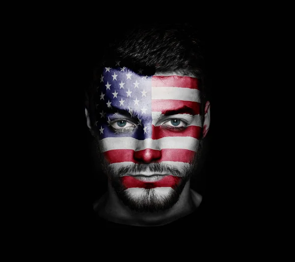 Flag of USA painted on a face of a man.