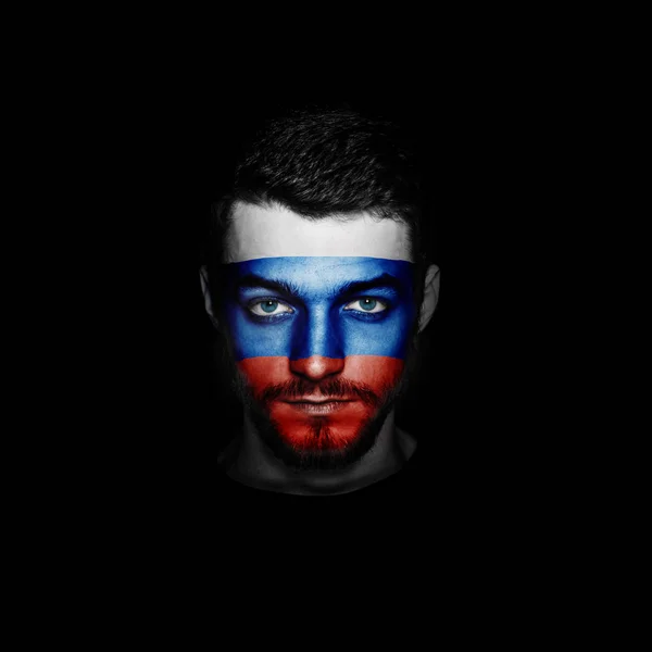 Flag of Russia painted on a face of a man. — Stock Photo, Image