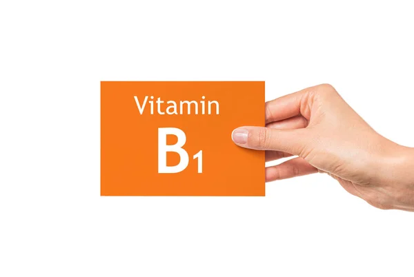 Female hand shows a card with the inscription Vitamin B1. Vitamin B1. — Stock Photo, Image