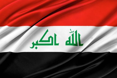 Rüzgarda dalgalanan renkli Irak bayrağı.