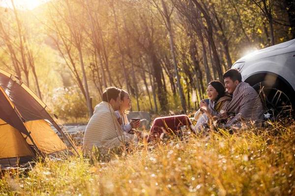 Four Asian Friends Drinking Tea Talking Camping Place Autumnal Forest — Stock Photo, Image