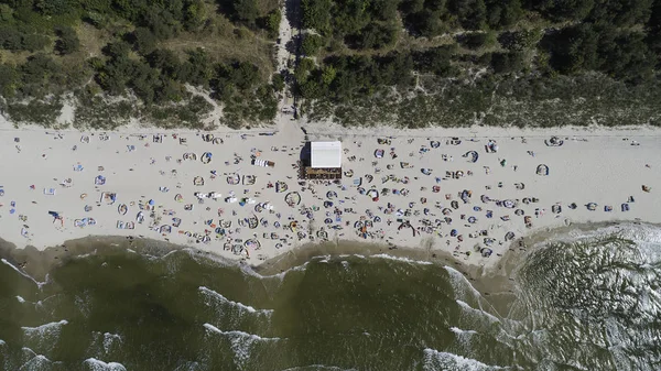 view of the beach and the sea from a bird\'s eye view