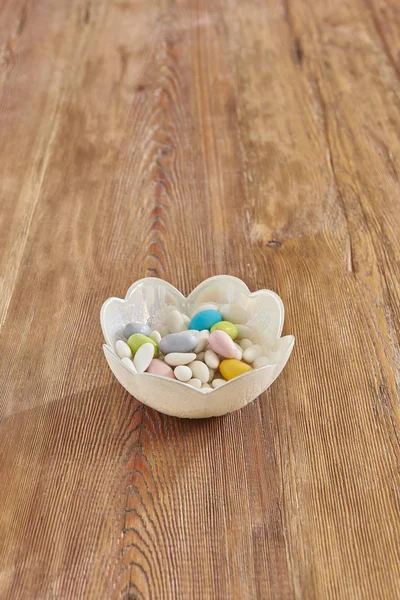 feast candies in the plate on background