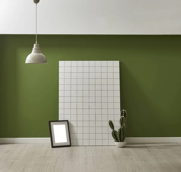 modern green wallpaper and mock up interior decoration with cactus and frame